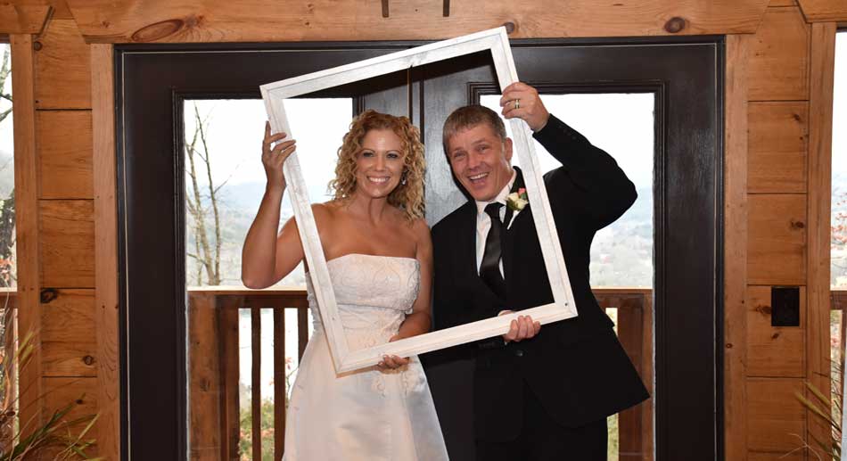 Bride and Groom pose inside Eureka Springs Reiverview Wedding Chapel